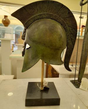 Bronze-Spartan-helmet-with-Greek-pattern-on-crest-on-marble-base