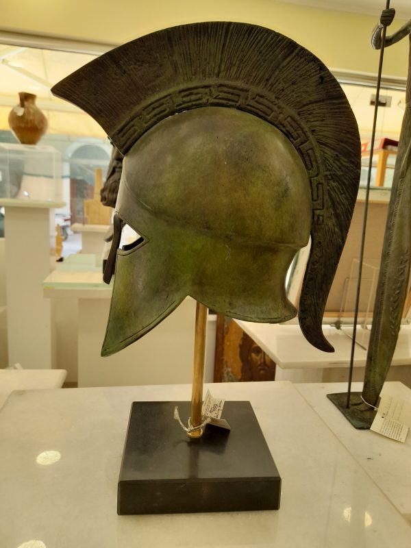 Bronze-Spartan-helmet-with-Greek-pattern-on-crest-on-marble-base